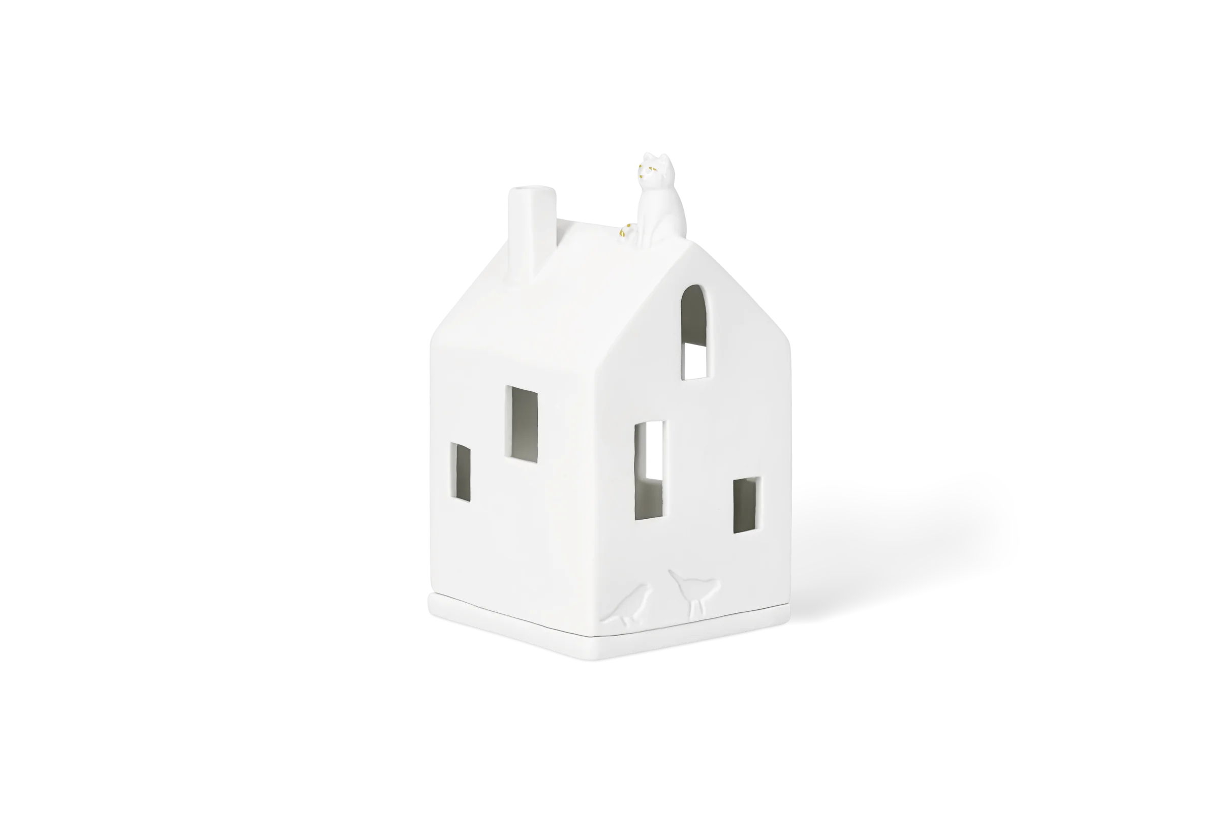 Lichthaus Katze Weißes Lichthaus mit Katze auf dem Dach, Schornstein, Fenstern und eingeprägten Vögeln in der vorderen Linksansicht.