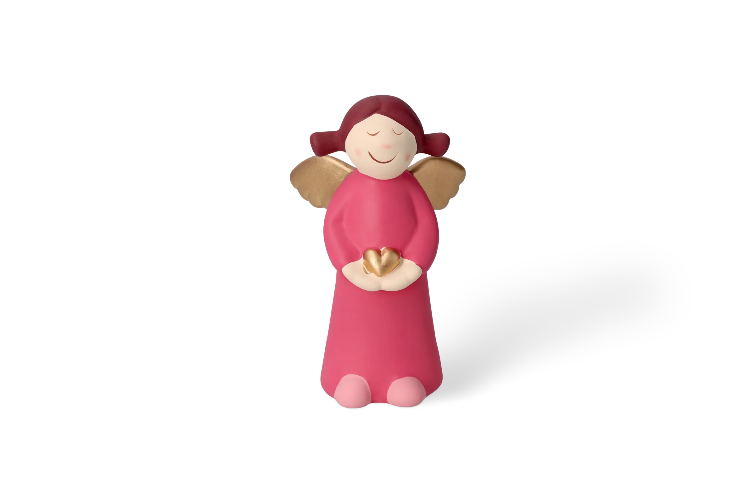 Engel Charlotte Mittel - Edition 9 Dekofigur Himmlische Schwester mit goldenen Flügeln, die ein pinkes Kleid trägt und ein goldenes Herz hält, in der Vorderansicht.