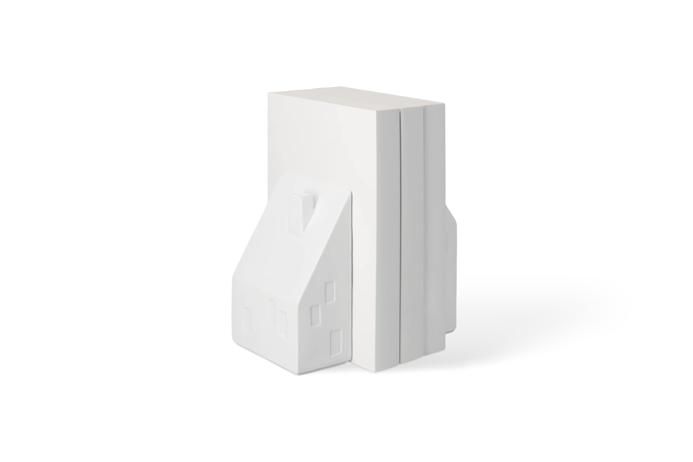 Buchstütze Doppelhaushälften Weiße Buchstütze Doppelhaushälften in Hausform mit eingeprägten Fenstern und Schornstein, in der vorderen Linksansicht Nummer 2.
