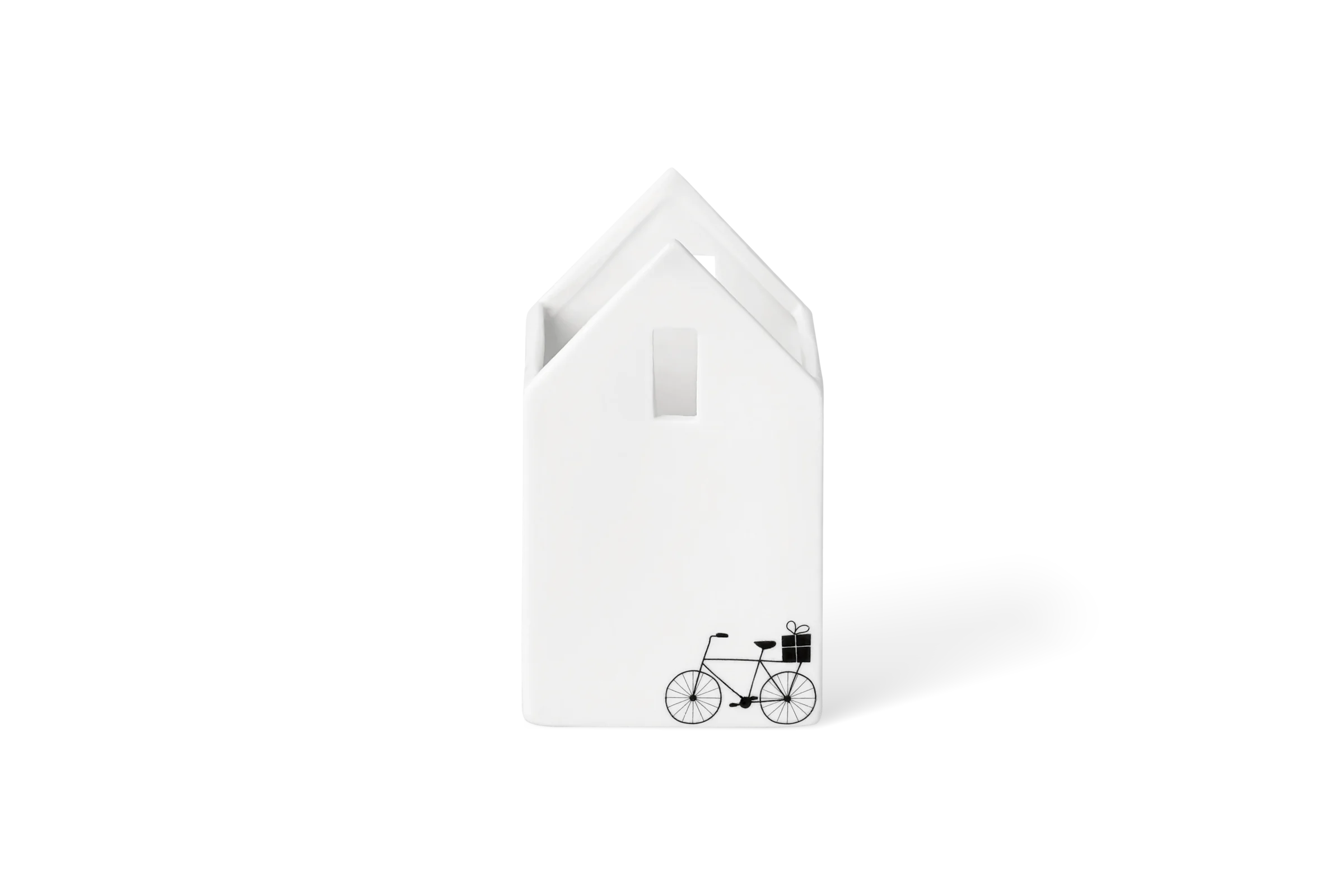 Weißer Teelichthalter in Hausform mit schwarzem Fahrrad und Geschenk auf der Rückseite, in der Rückansicht.