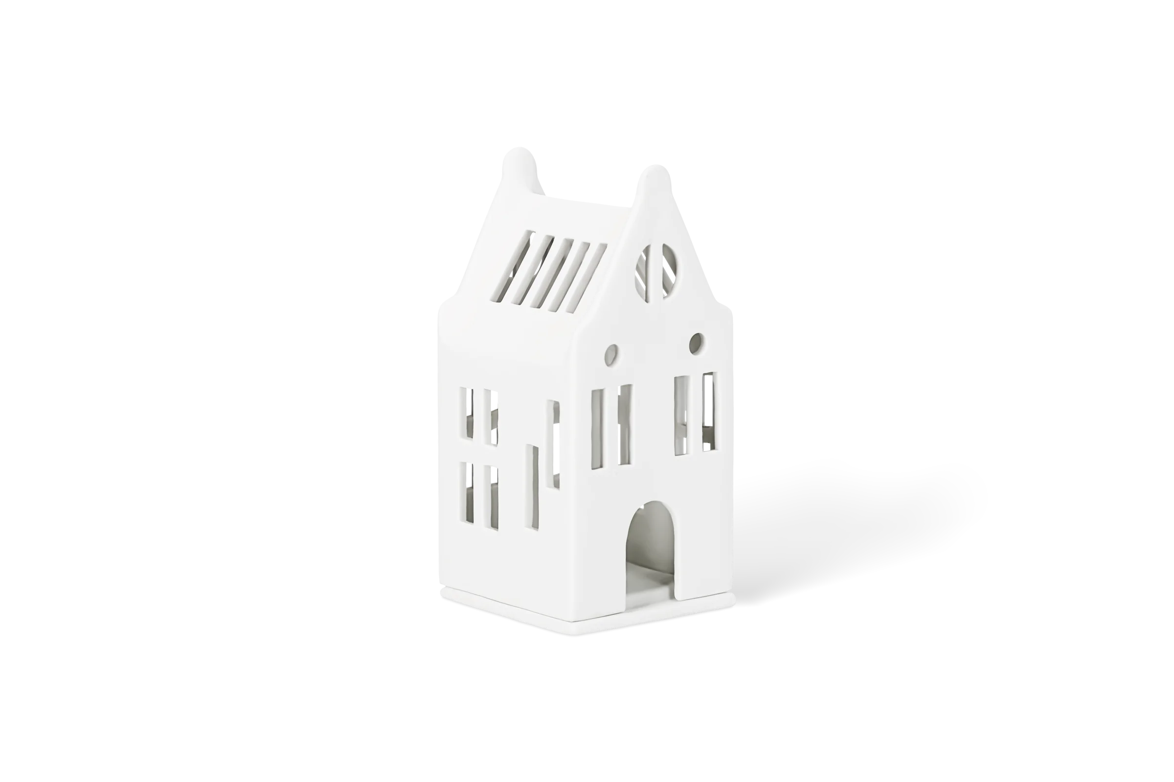 Mini-Lichthaus Herrenhaus Weißes Lichthaus in Form eines Hauses mit Fensteröffnungen, Giebeldach und Rundbogentür in der vorderen Linksansicht.