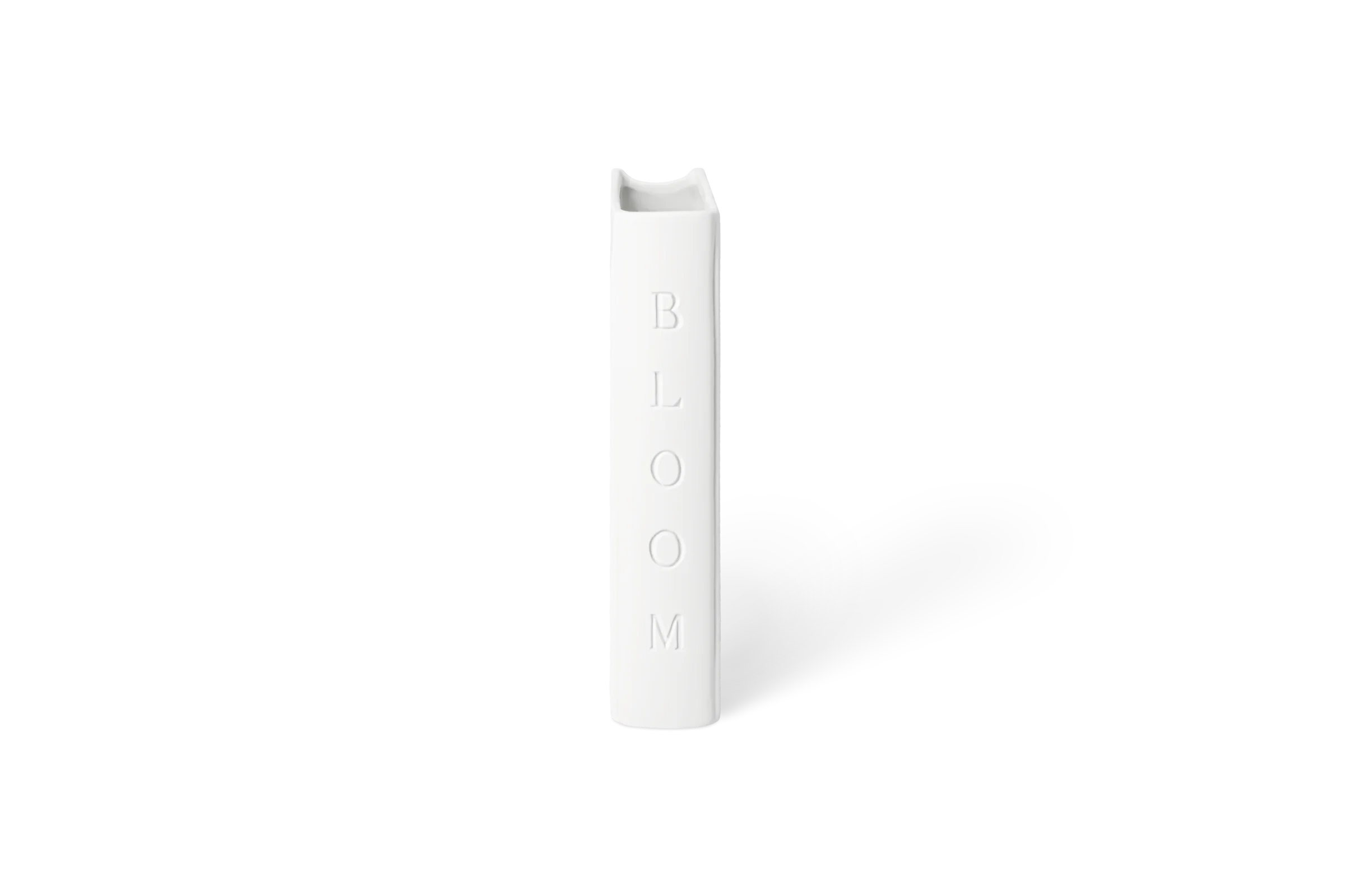 Weiße Vase Leseglück in Buchform mit eingeprägtem Schriftzug BLOOM in der Linksansicht.
