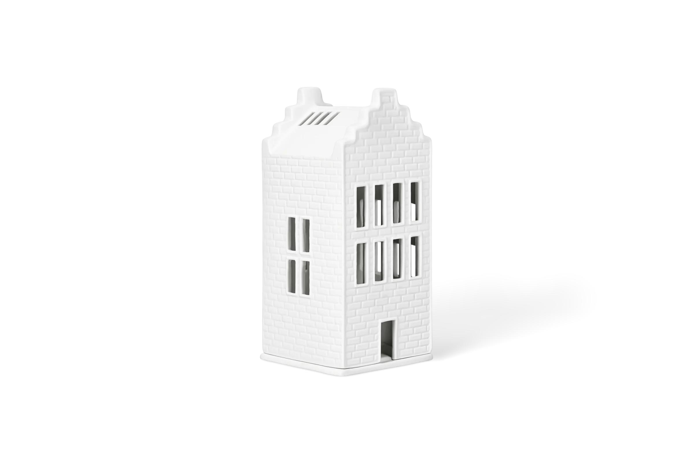 Lichthaus Großes Backsteinhaus Weißes Lichthaus mit eingeprägter Ziegelstruktur, Fenstern und Tür in der vorderen Linksansicht.