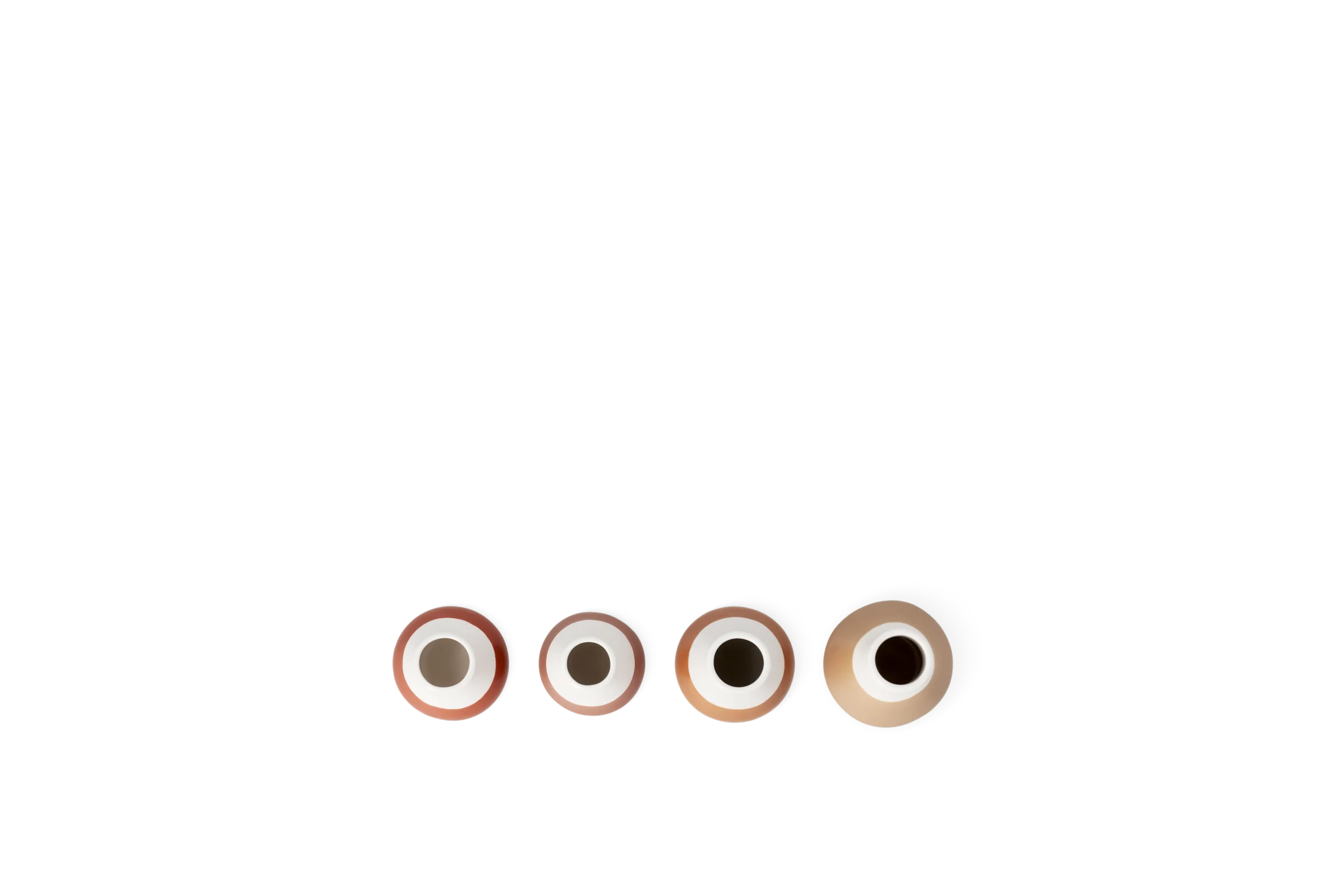Vier Minivasen der Serie Blütezeit in Rosa, Weiß und Beige mit runden Öffnungen in der Draufsicht.
