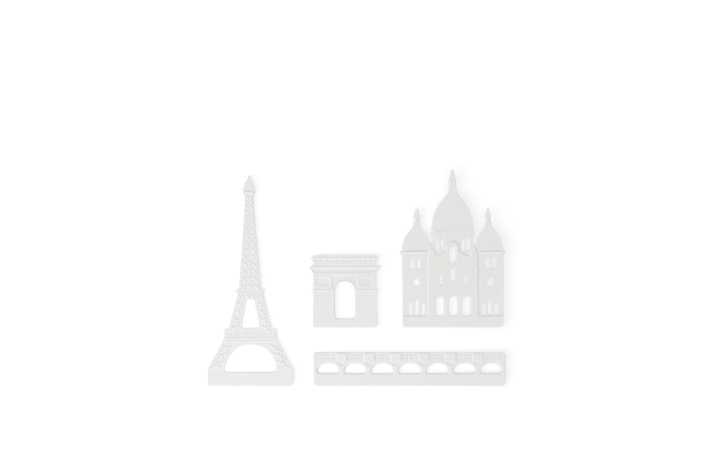 Weiße Einzelteile der Lichtszene Stadtsilhouette Paris mit Eiffelturm, Triumphbogen, Basilika Sacré-Cœur und Brücke in der Teileansicht.