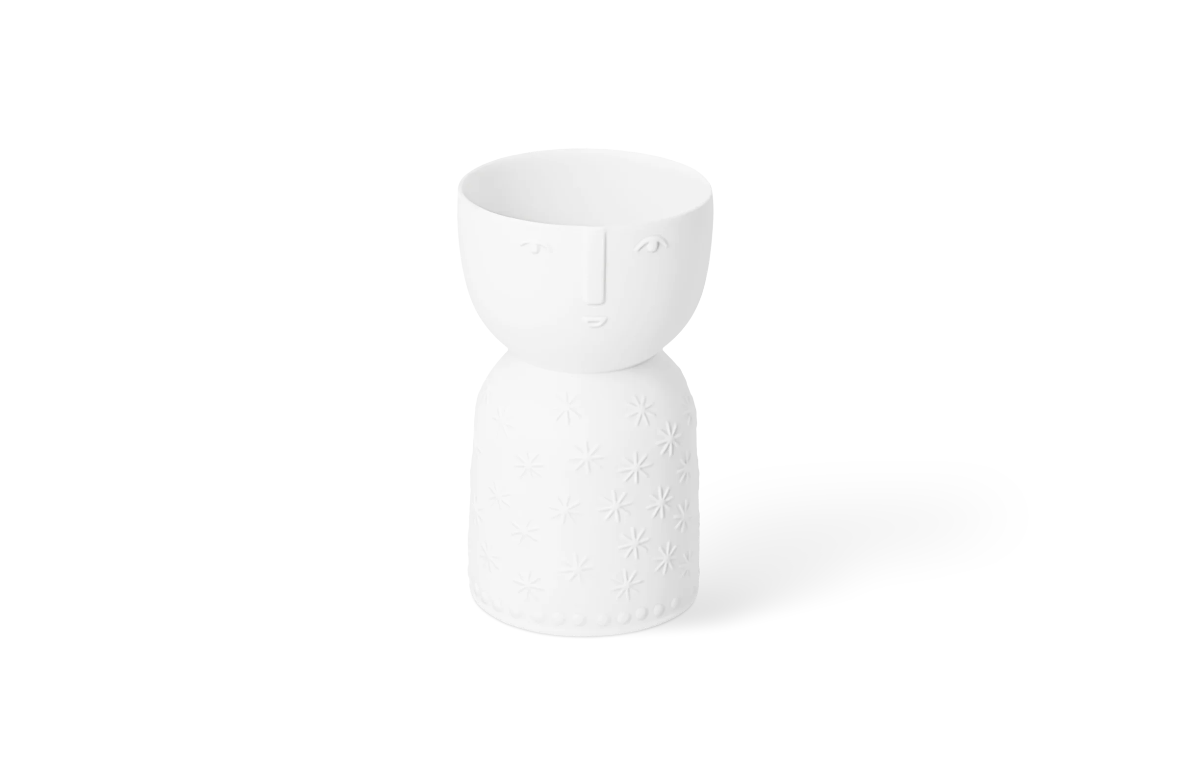 Vase Naturgestalt Stella Weiße Vase in Figurenform mit Gesicht, erhabenen Sternen und Punkten am Fuß in der Vorderansicht.