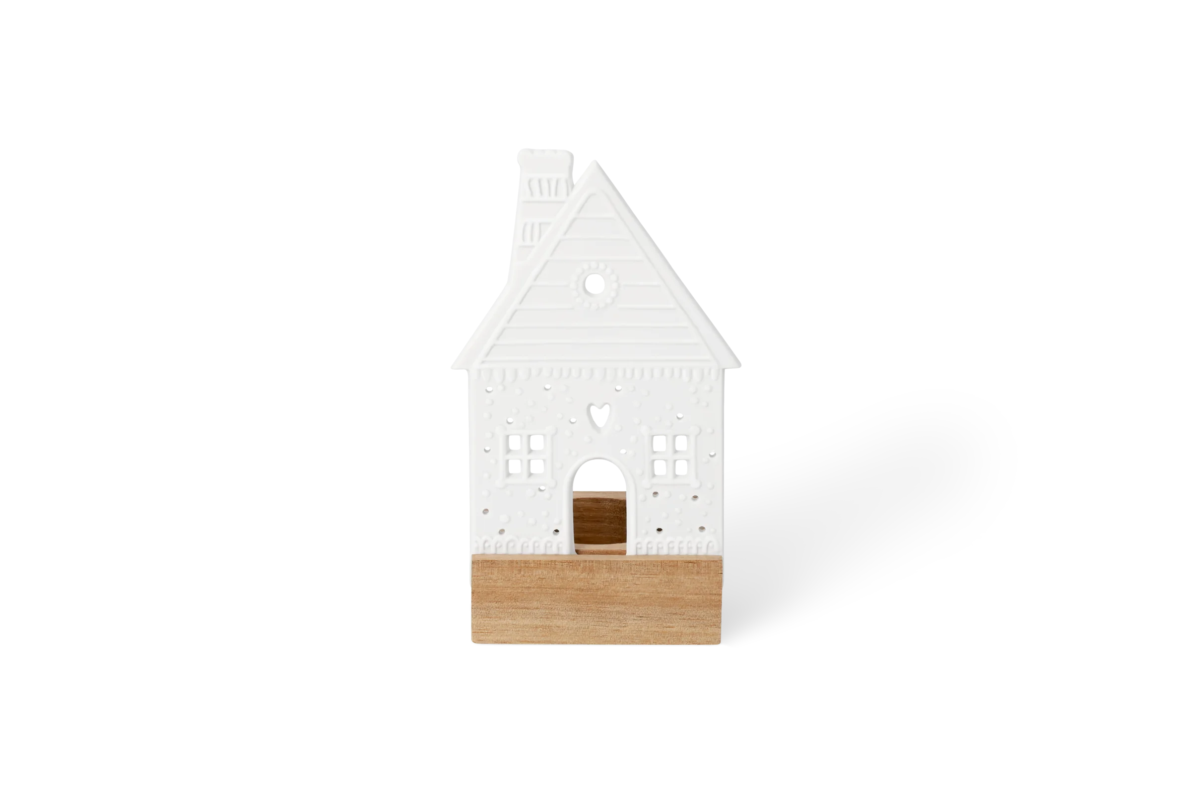Lichtszene Lebkuchenhaus Weiße Lichtszene Lebkuchenhaus mit Holzsockel, Fenstern, Herz und erhabenen Verzierungen in der Vorderansicht.
