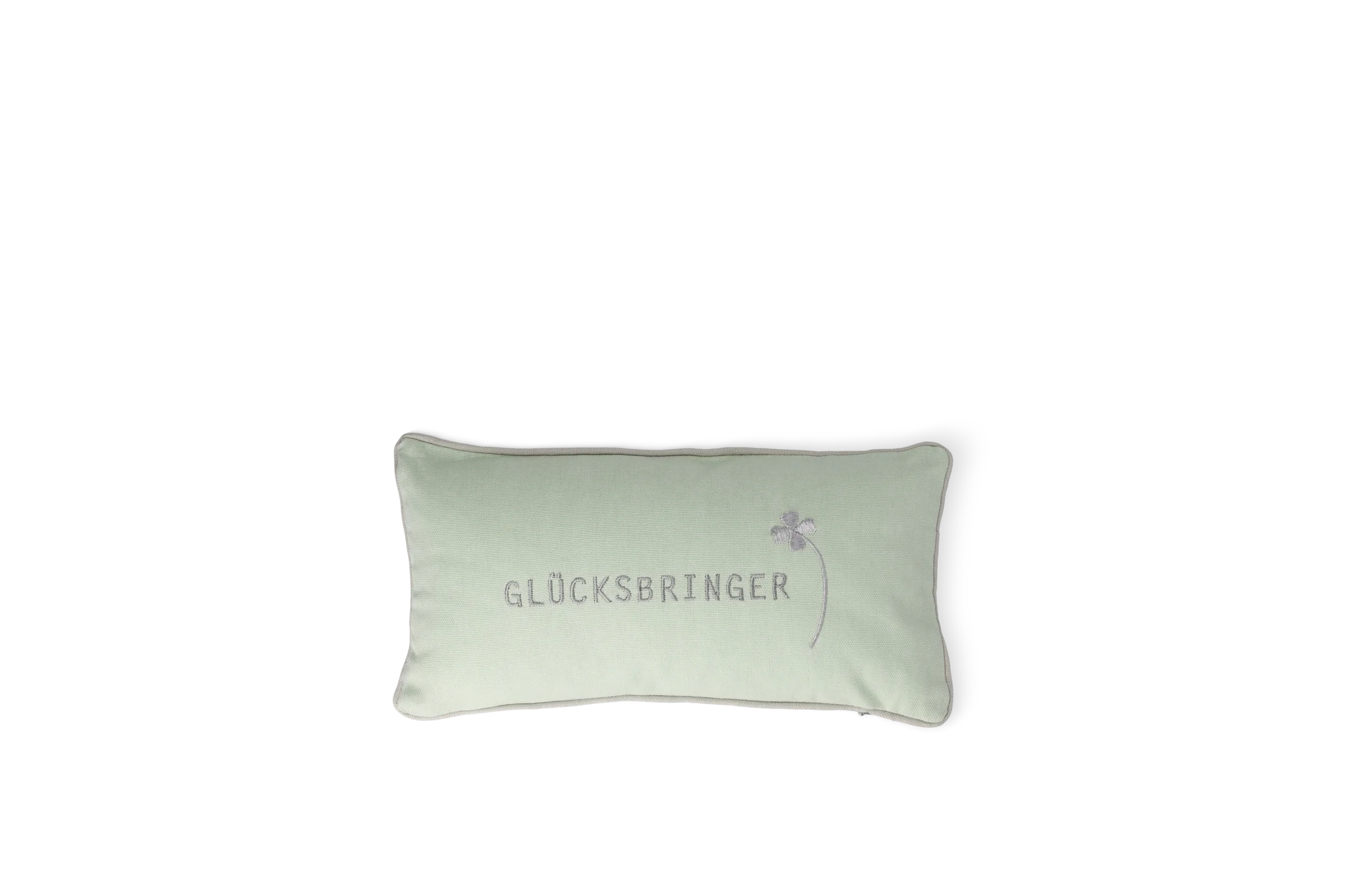 Traumkissen Glücksbringer Hellgrünes rechteckiges Traumkissen mit grauer Aufschrift „Glücksbringer“ und Kleeblattmotiv in der Vorderansicht.