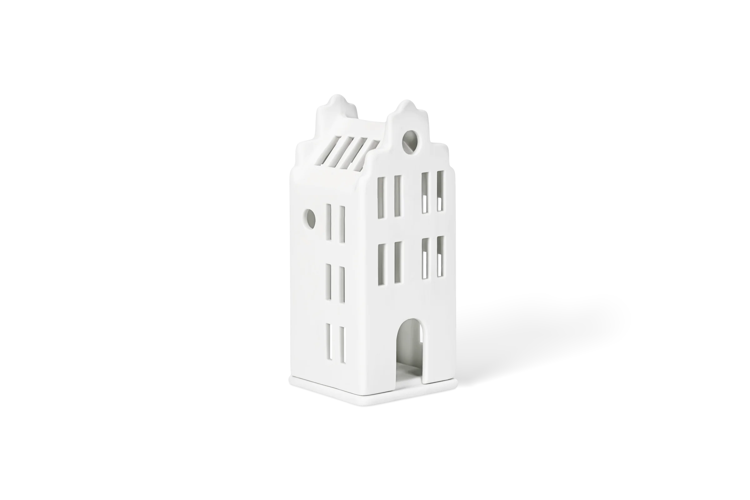 Mini-Lichthaus Grachtenhaus Weißes Lichthaus in Form eines Stadthauses mit Fensterausschnitten und Rundbogen, in der vorderen Linksansicht.