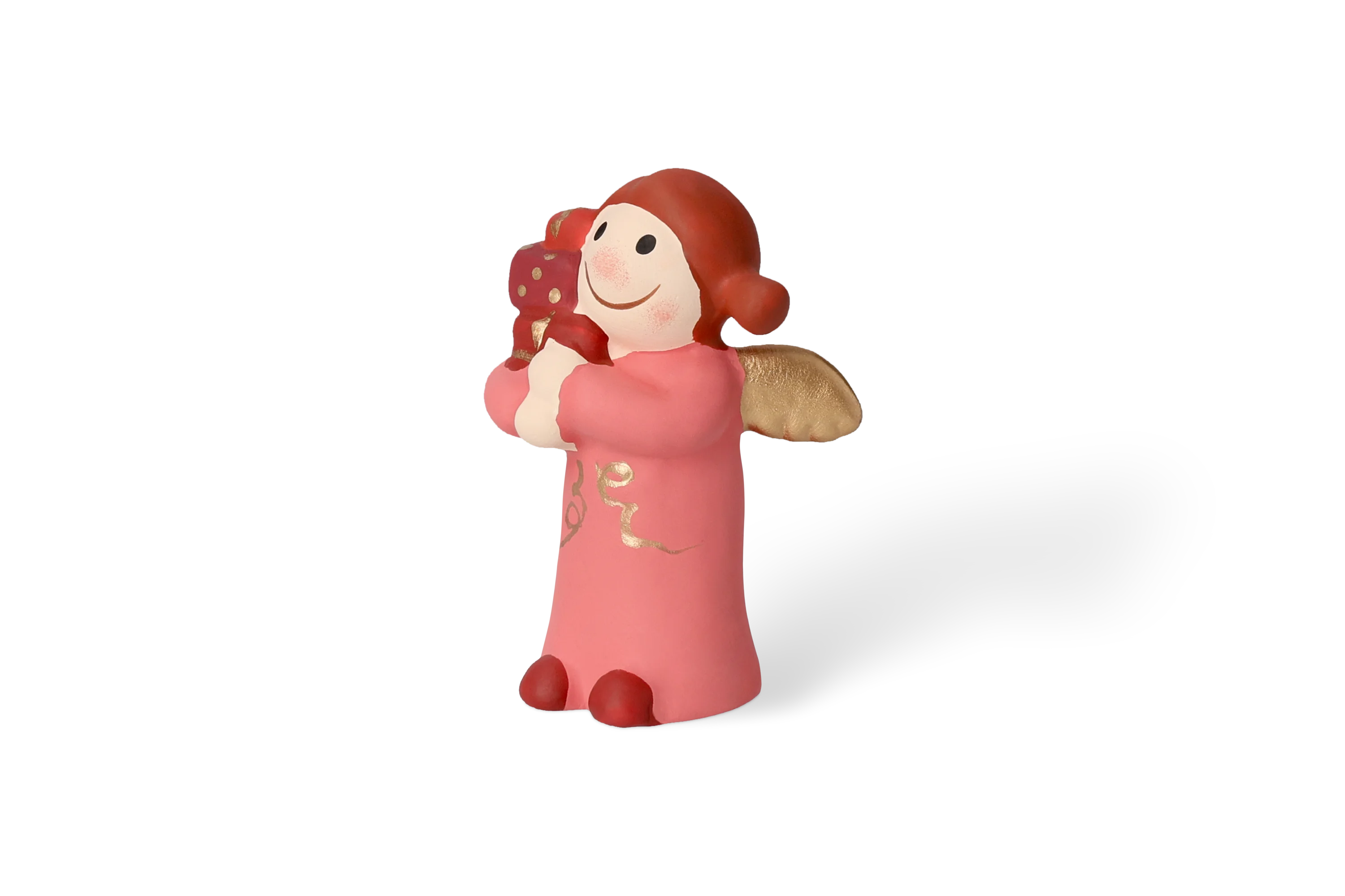 Vordere Rechtsansicht Dekofigur Himmlische Schwester mit goldenen Fluegeln im rosa Kleid haelt Geschenkpakete in rotgoldener Verpackung